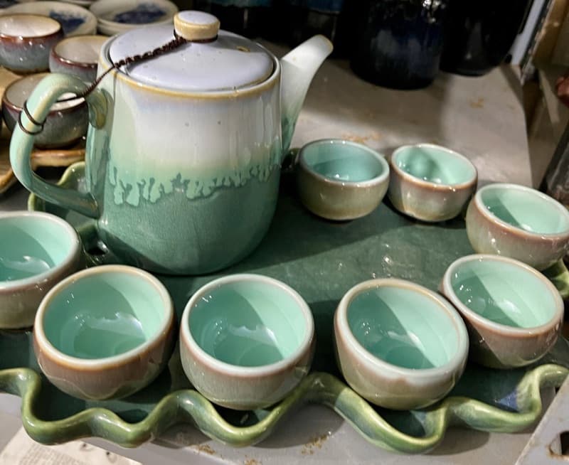 Jade drip-glaze teapot with six cups on a wave tray
