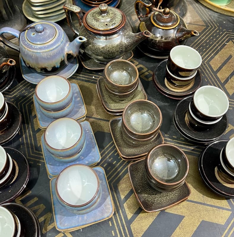 Lilac and tenmoku cups on square saucers